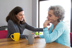 caregiver-comforting-senior-aging-parent