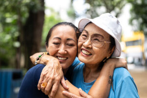 A woman who knows what you should never say to someone with dementia hugs her elderly mother.